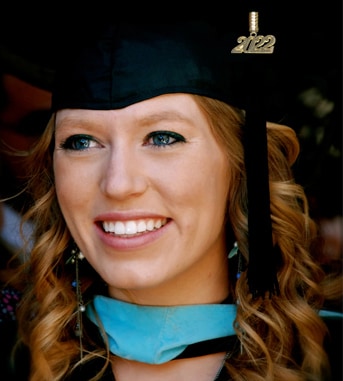 Graduate wearing a graduation cap at the ceremony
